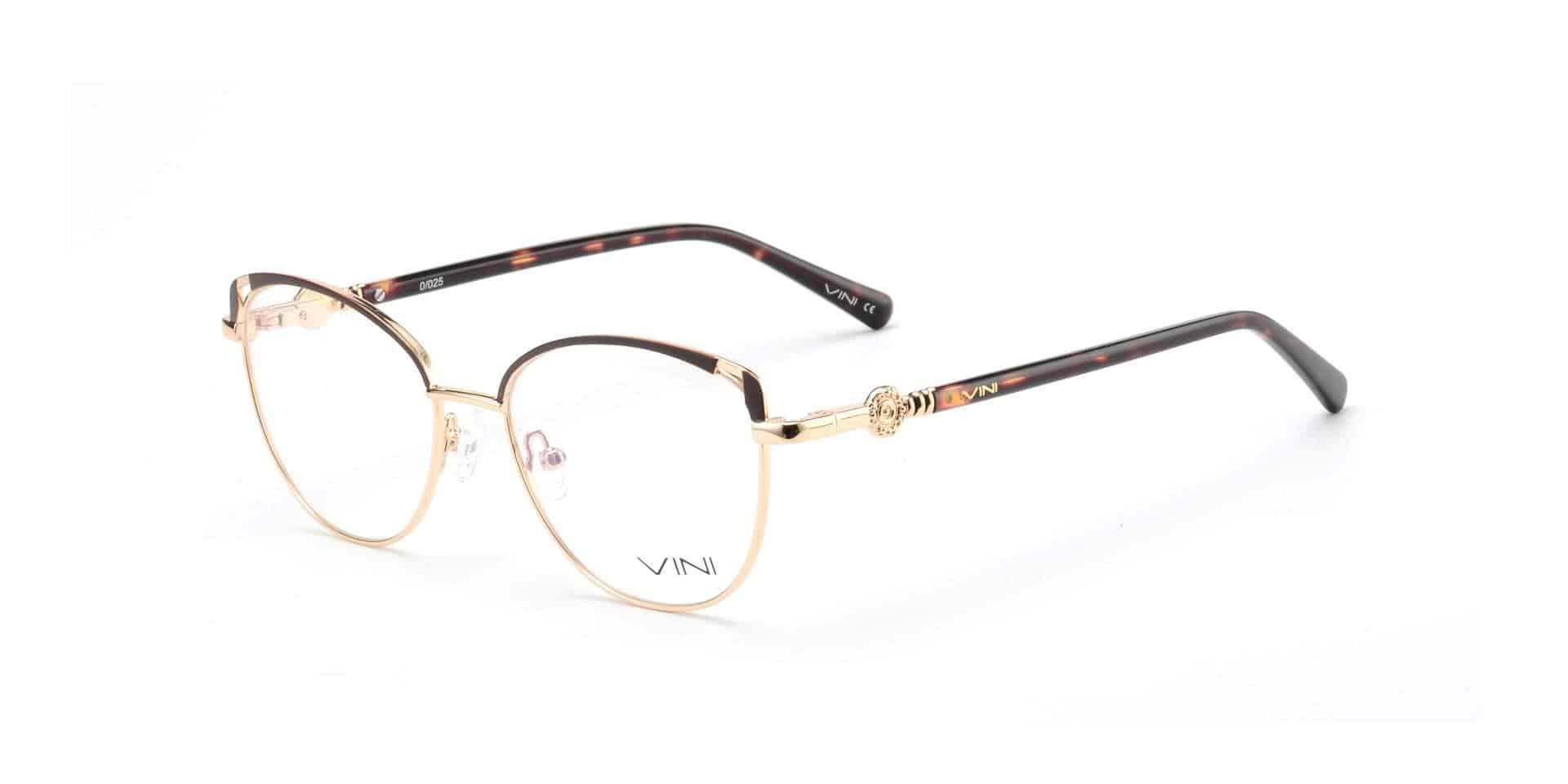 משקפי ראייה עם מסגרת זהב, עדשות עגולות, זרועות בצבע חום בהיר עם דוגמת צב, ופרט ורד על הציר.
