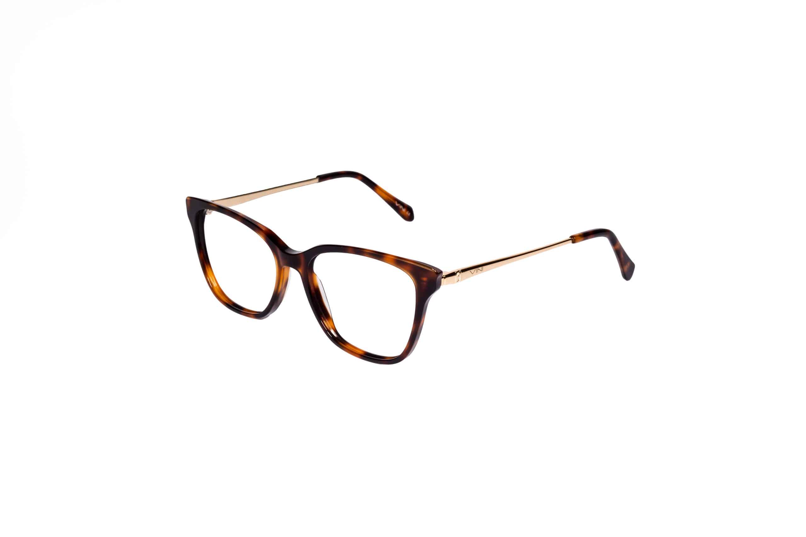 משקפיים בצבע חום-שבלולי עם זרועות מתכת מוזהבות, מוצגים על רקע לבן.